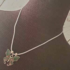 Cool Jewels boho 90s vibes butterfly necklace on gray cord